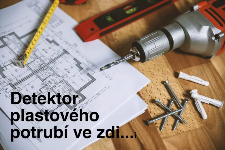 Vrták s nářadím na plánu pro nalezení potrubí ve zdi.