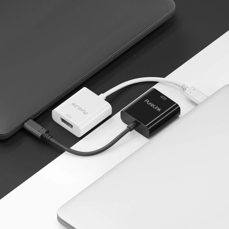 Bílá a černá adaptér HDMI připojené k portu USB-C na notebookech.