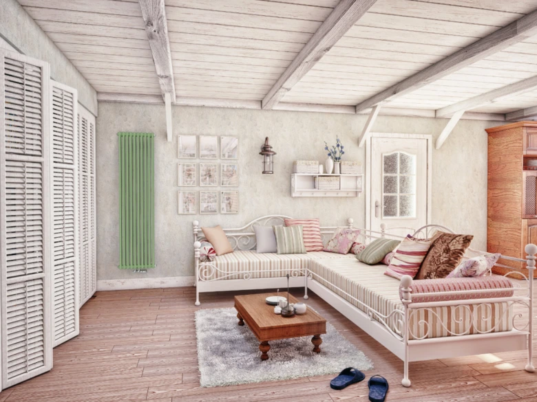 Obývací pokoj s litinovým radiátorem na stěně.