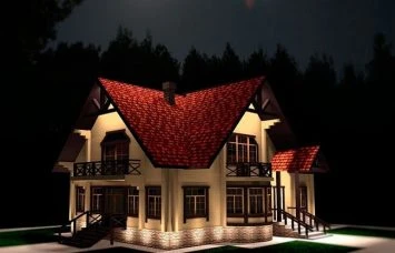 Dům osvětlený nočními světly v lesním prostředí.