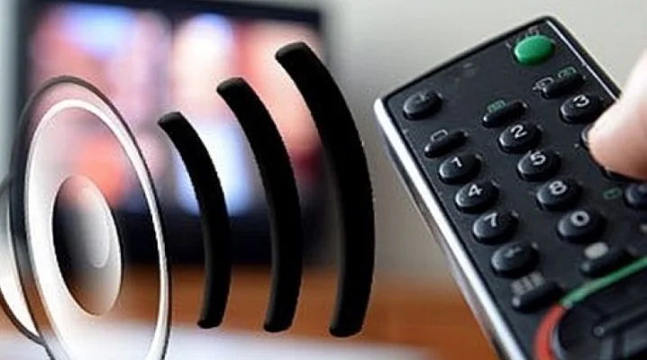 Ručník ovládání televize s vlnami zvuku ukazující problémy se zvukem.