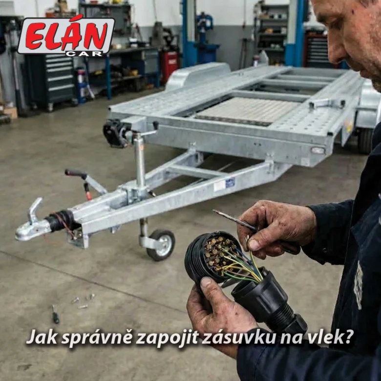 Muž zapojuje zásuvku na vlečnou zařízení v dílně.
