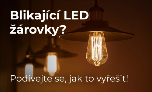 Zapálený LED žárovka visící pod stropní svítidlem s rozostřeným pozadím.