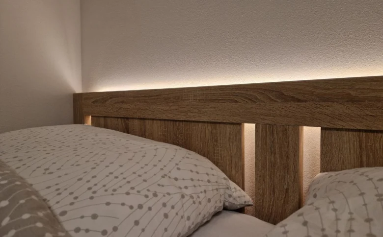 Bed with led headboard lighting