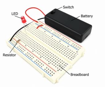 LED dioda na plošce s baterií pro ukázku polarita